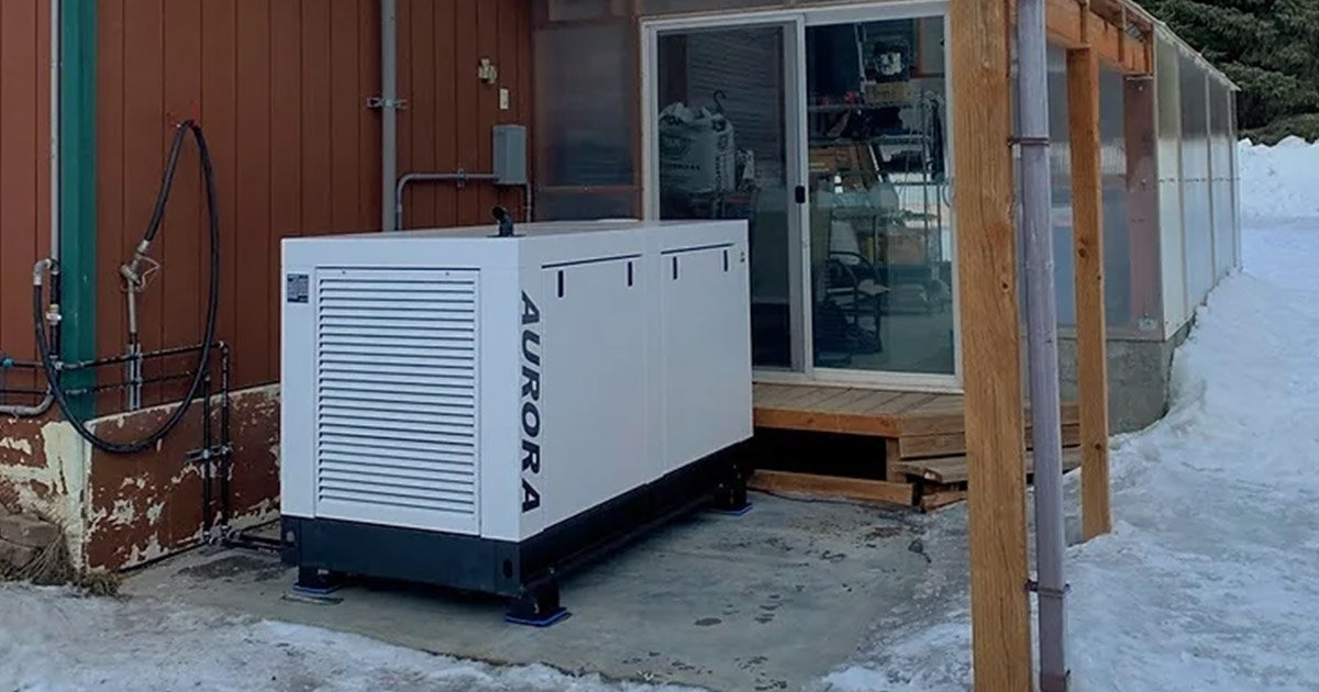 customer photo of an aurora quiet diesel generator next to a home